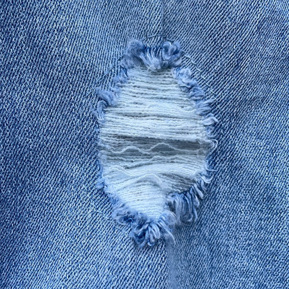 Rip and repair mid-rise skinny jeans